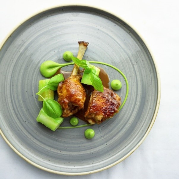 Chicken leg braised in peanut butter jus with broccoli and toasted sesame puree%2C broccoli stem by Kareem Roberts